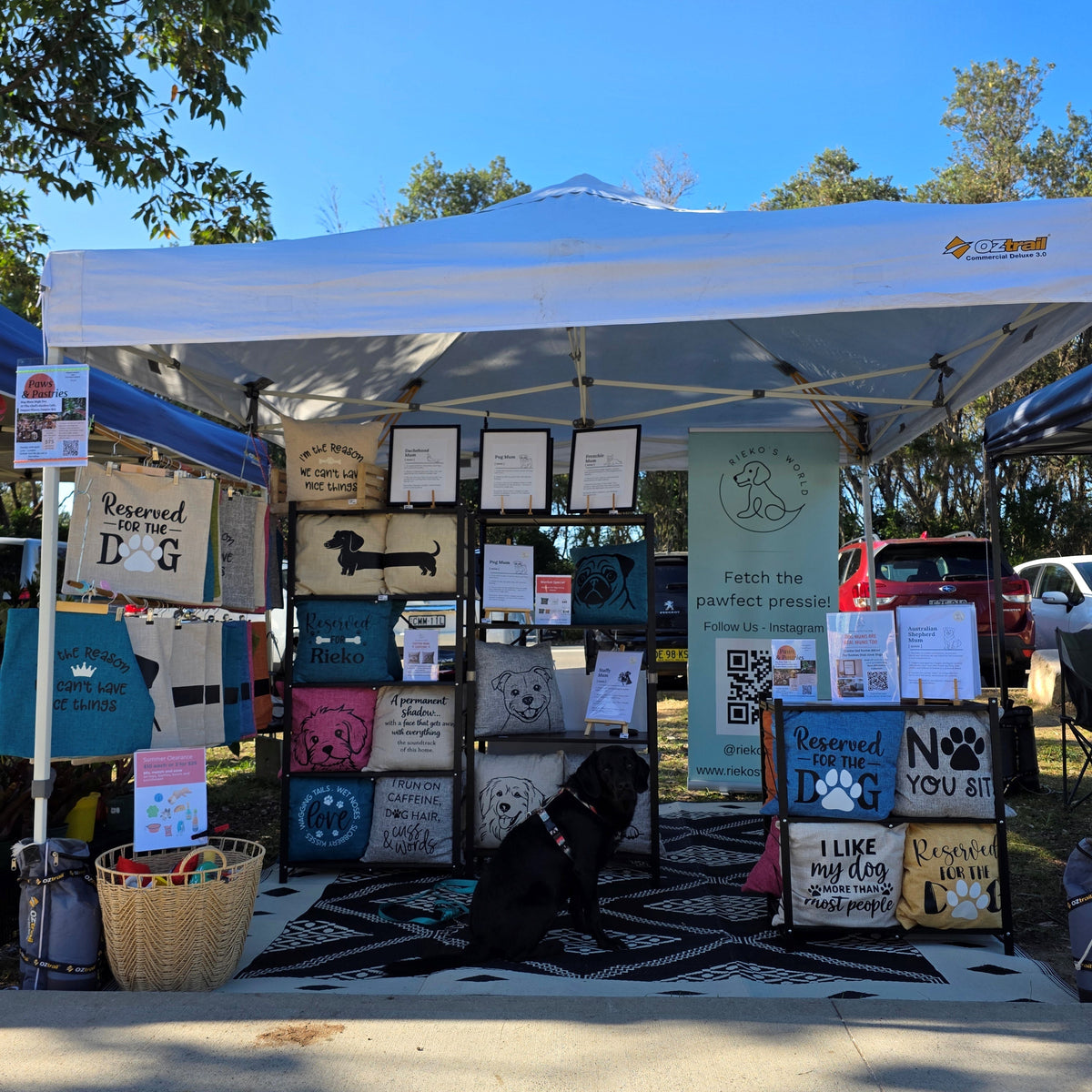 Rieko's World setup at markets to shop dog under gazebo