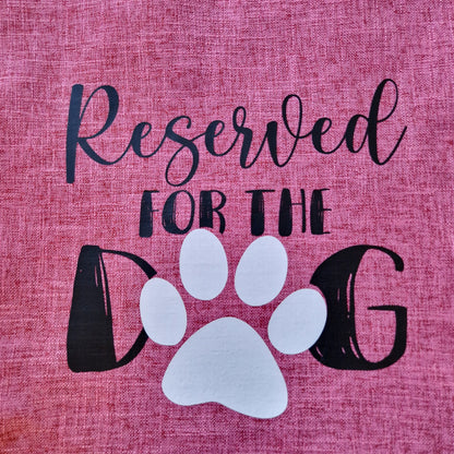 A pink cushion cover with 'Reserved for the Dog' text and a paw - dog gift in Australia made by Rieko's World.