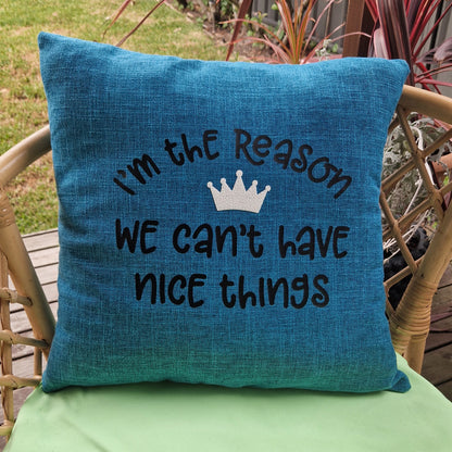 I'm the Reason We Can't Have Nice Things teal funny dog mum cushion cover on rattan chair in garden — dog home decor gift Australia by Rieko's World