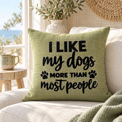 I like my dogs more than most people funny quote on green cushion on beige chair