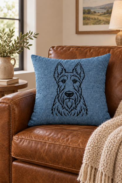 Scottish Terrier outline cushion cover in blue linen on a light country setting on brown leather sofa with cream throw.