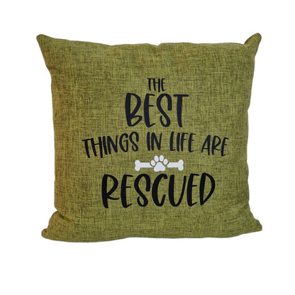 A close up of a green cushion cover on white background with text the best things in life are rescued on beige sofa in Australia by Rieko's World.